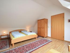 a bedroom with a bed and two closets in a room at Countryside apartment with garden in Schallstadt