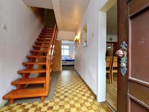 a staircase in a house with a checkered floor at Cozy holiday home with WiFi in Hochsauerland in Elpe