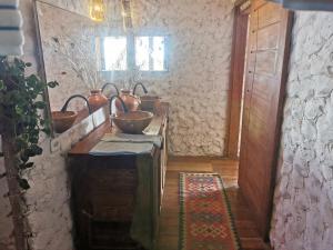 a kitchen with a table with a bowl on it at Beach Bungalow-KiteAliCori , Macapa' in Luis Correia
