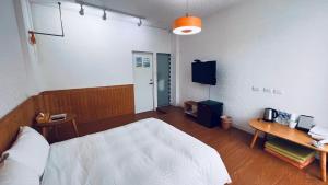 Postel nebo postele na pokoji v ubytování Rainbow Island