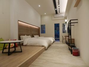 Posteľ alebo postele v izbe v ubytovaní 谷關明高溫泉 Mingao Hot Spring Resort