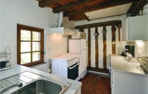 a kitchen with a sink and a refrigerator at Beautiful Home In Vert With 2 Bedrooms And Wifi in Vert