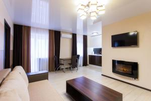 a living room with a couch and a fireplace at Luxury One bedrooms 23 August in Kharkiv