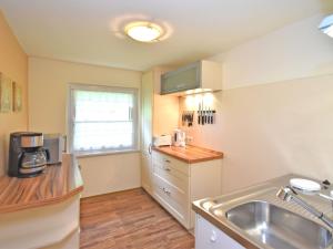 a kitchen with a sink and a counter top at Apartment in Saxony with terrace in Scheibenberg