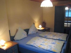 A bed or beds in a room at Snug Apartment in Morbach Riedenburg with Terrace