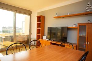 A television and/or entertainment centre at Cap Blanc Penthouse Cullera