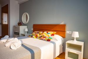 A bed or beds in a room at Cap Blanc Penthouse Cullera