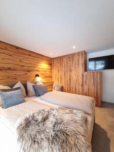 Voodi või voodid majutusasutuse Kaiser Traum Appartement - Wildschönau PREMIUM Card in Summer toas