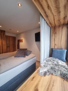 Voodi või voodid majutusasutuse Kaiser Traum Appartement - Wildschönau PREMIUM Card in Summer toas