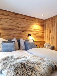 Voodi või voodid majutusasutuse Kaiser Traum Appartement - Wildschönau PREMIUM Card in Summer toas