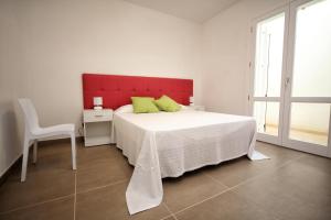 מיטה או מיטות בחדר ב-Case Vacanza Viola di Mare