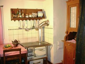 a kitchen with a sink and a stove in a room at Holiday home in Hesse with garden in Willingshausen
