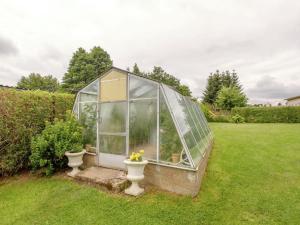 a greenhouse with two toilets in a yard at Holiday home in Hasselfelde with private terrace in Stiege