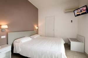 Postel nebo postele na pokoji v ubytování Hotel Saviola