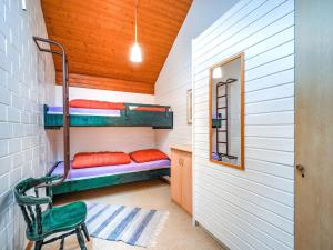 a small room with bunk beds in a house at Ferienhaus mit herrlicher Aussicht in Schmallenberg