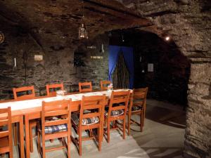 a dining room with a long table and chairs at Pleasant Apartment in Ernst bei Cochem with Garden in Ernst