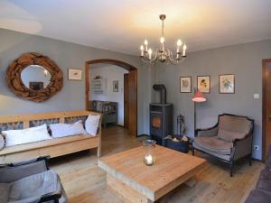 a living room with a couch and a table at Idyllic holiday home near the ski area in Winterberg