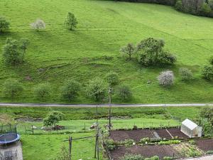 an aerial view of a field with a road at Idyllic holiday home with private terrace in Mühlenbach