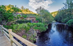 a view of a river from a wooden bridge at 1 Bedroom Gorgeous Apartment In La Omauela in La Omañuela