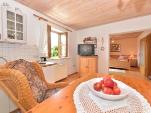 a living room with a table and a bowl of fruit at Flat in Bayerisch Eisenstein with garden in Bayerisch Eisenstein