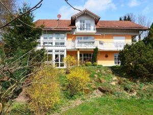 a large house on top of a hill at Flat with sauna in the Bavarian Forest in Waldkirchen