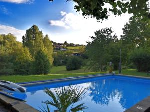 a swimming pool in the yard of a house at Apartment in Regen with Terrace in Regen