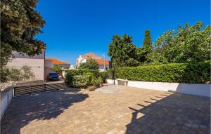 a parking lot in front of a house at Amazing Apartment In Mandre With Wifi in Mandre +21 photos