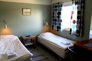 
Säng eller sängar i ett rum på Suderbys Herrgård

