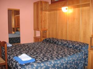 เตียงในห้องที่ Hotel Casale