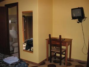 TV a/nebo společenská místnost v ubytování Hotel Casale