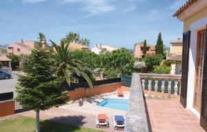 a view of a swimming pool from a house at Stunning Home In Sa Coma With 3 Bedrooms And Outdoor Swimming Pool in Sa Coma