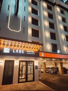 a large building with a large hotel with a garage at LABE Hotel in Jeonju