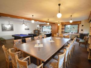 a large dining room with a large table and chairs at Holiday home in Monschau with sauna in Alzen