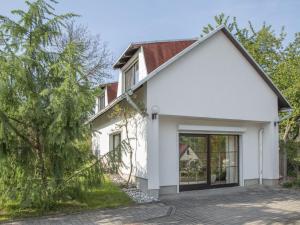 a white house with a red roof at Holiday home near forest in Fischbach in Emsetal