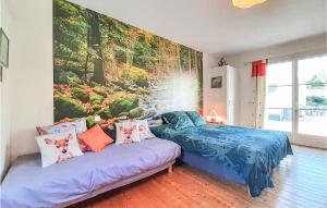 a bedroom with a bed and a couch at Cozy Apartment In Alette With Wifi in Alette