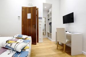 TV a/nebo společenská místnost v ubytování Sofia's Suites Guesthouse