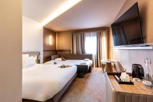 Postel nebo postele na pokoji v ubytování Novotel Paris Orly Rungis Aéroport