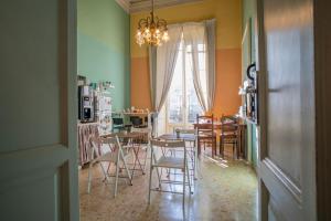 a kitchen and dining room with a table and chairs at San Demetrio in Catania