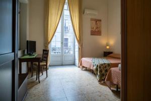 A bed or beds in a room at San Demetrio