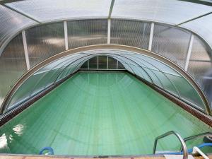 an overhead view of a swimming pool in a building at Holiday home near the Klingenthal ski resort in Beerheide