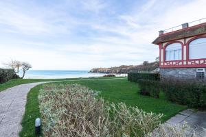 a house with a view of the ocean at Castaline in Saint-Cast-le-Guildo +3 photos