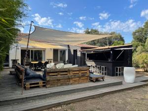 a wooden deck with a tent on top of a house at LA MANOSC in Grimaud