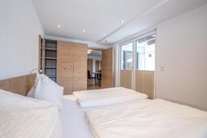Postel nebo postele na pokoji v ubytování Gästehaus Sonne
