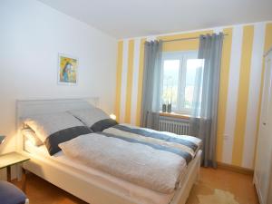 Apartment in Hauzenberg with private terrace tesisinde bir odada yatak veya yataklar
