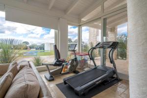 a living room with a couch and a gym at Villa LUCI' in Puglia, vicina alla VALLE DI ITRIA in Mottola
