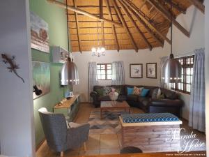 a living room with a couch and a table at Moritshane estate in Gaborone