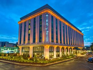 a large building with a sign on the side of it at Elite World Istanbul Florya in Istanbul