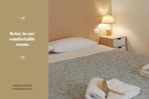 Posteľ alebo postele v izbe v ubytovaní AMARE MATERA comfortable rooms