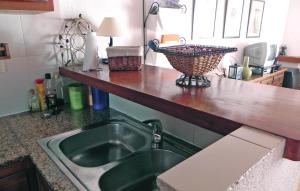 a kitchen with a sink and a counter top at Tropicanapark in Denia