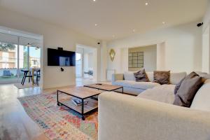 A television and/or entertainment centre at Villa Port Andratx by Slow Villas